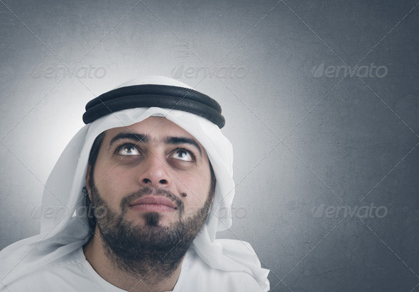 traditional arabian businessman thinking with space for graphic or text - Stock Photo - Images