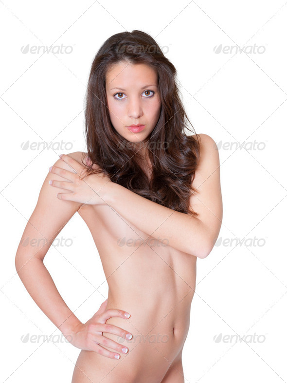 Nude brunette model covering her breasts - Stock Photo - Images