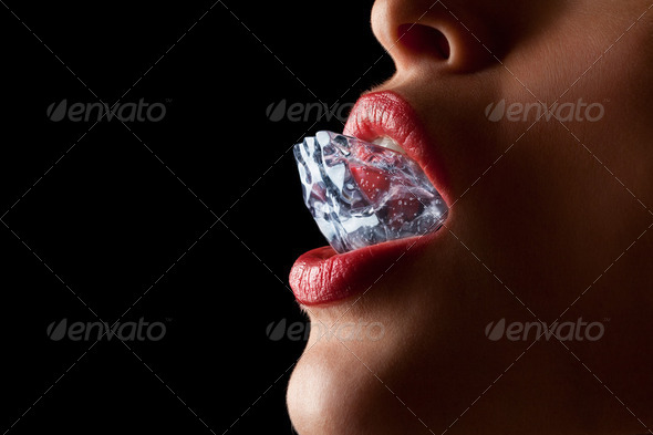 Ice cube in woman's mouth. - Stock Photo - Images