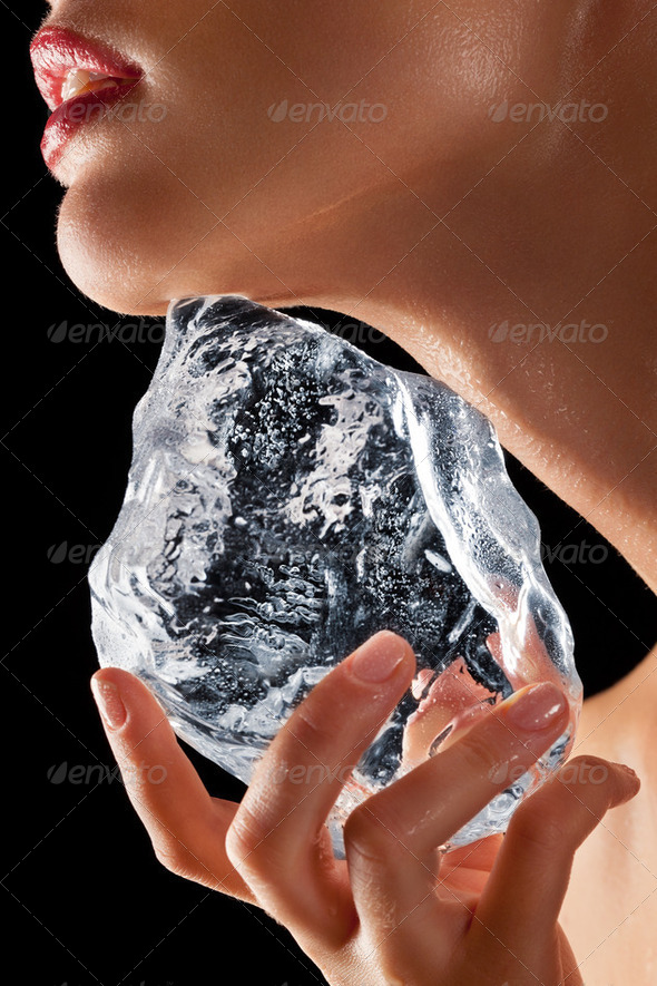 Woman holding ice to neck. - Stock Photo - Images