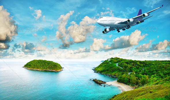 Jet liner over the tropical island - Stock Photo - Images