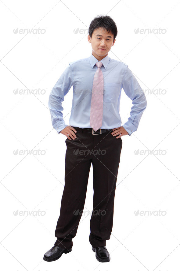 full length business man with confident smile - Stock Photo - Images