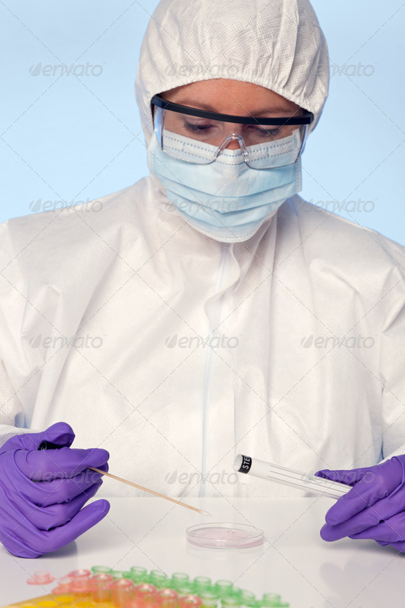 Lab technician taking a swab - Stock Photo - Images