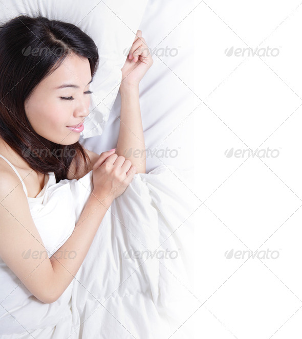 Woman sleeping on the bed in the morning - Stock Photo - Images