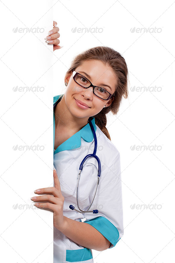 Smiling medical doctor woman holding blank billboard isolated on white - Stock Photo - Images