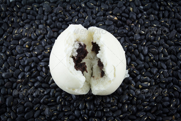 steamed dumpling on top of beans - Stock Photo - Images