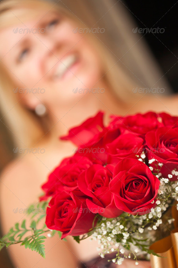 Surprised Attractive Blonde Woman Accepts Gift of Red Roses. - Stock Photo - Images