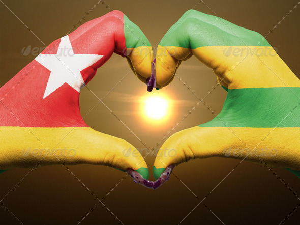 Heart and love gesture by hands colored in togo flag during beau - Stock Photo - Images