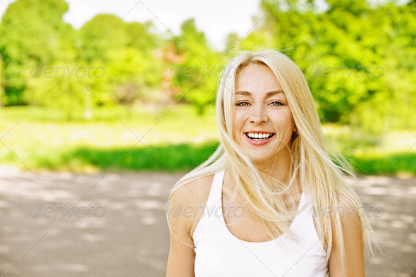 young woman laughs merrily - Stock Photo - Images