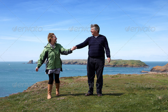 Mature couple on the coastal path - Stock Photo - Images