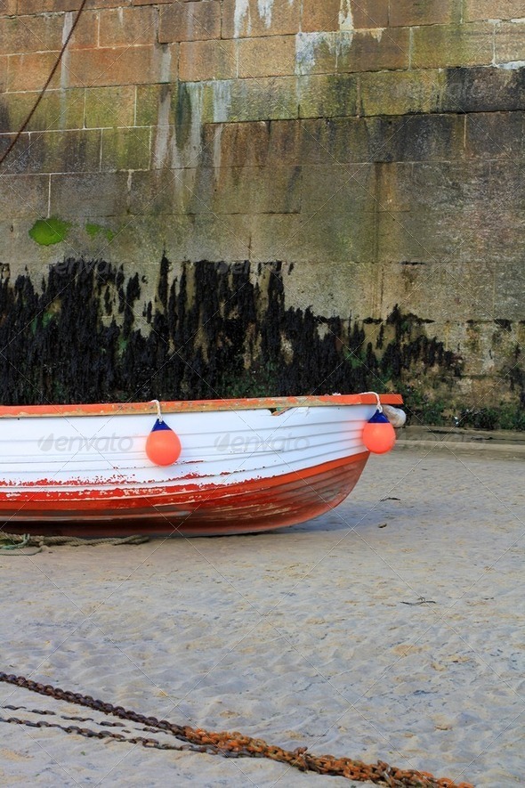 Red and White Wooden Boat with Buoys and Chain - Stock Photo - Images
