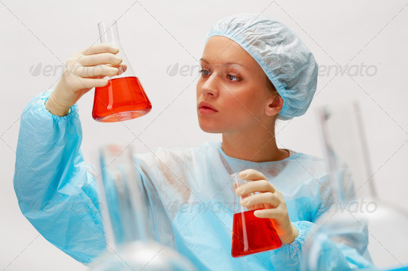 Scientist with glassware - Stock Photo - Images