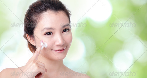 woman washing face with foam on green - Stock Photo - Images