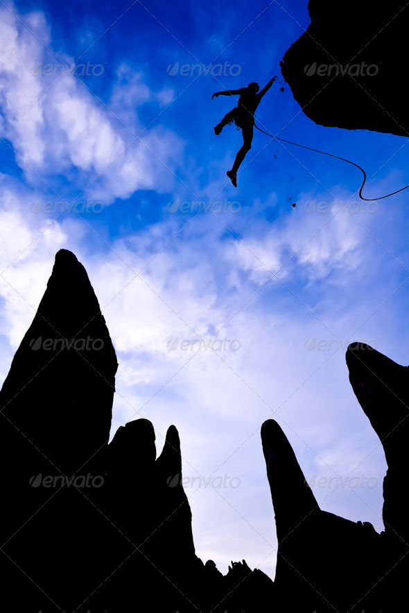 Rock climber in danger. - Stock Photo - Images