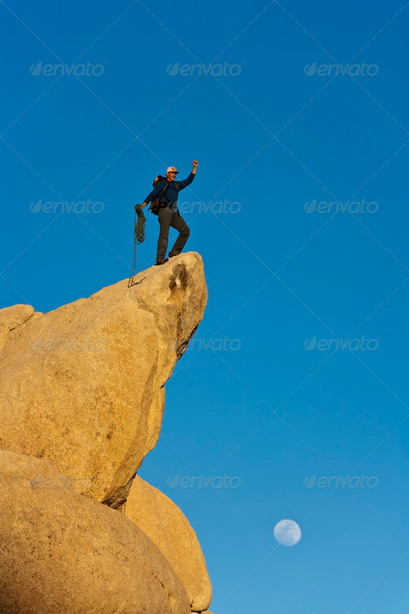 Climber on the summit. - Stock Photo - Images