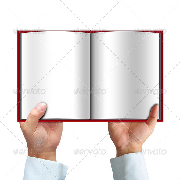 Opened book in hand - Stock Photo - Images