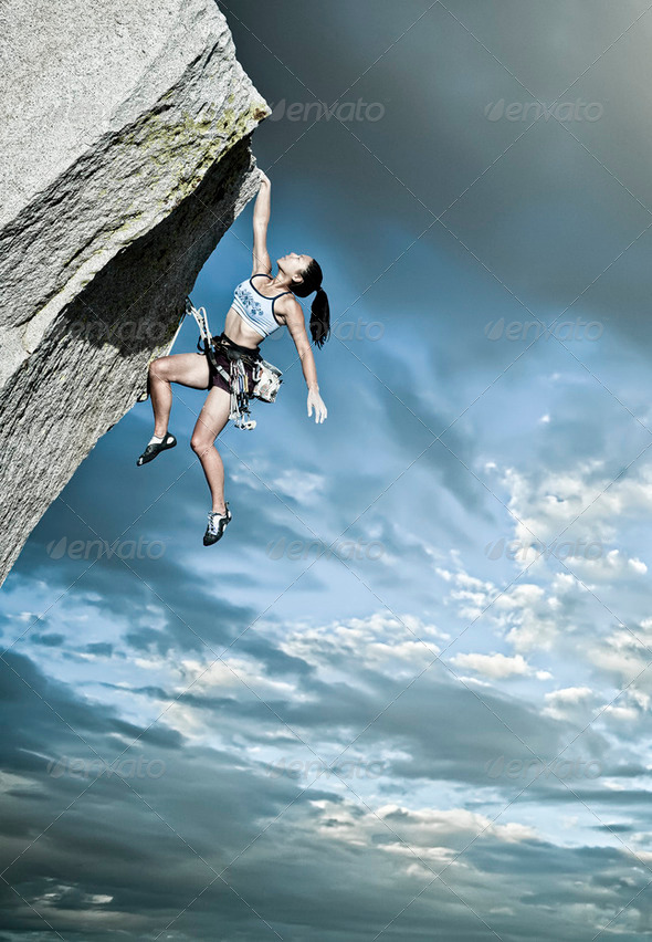 Rock climber clinging to a cliff. - Stock Photo - Images