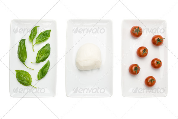 Italian food like flag, basil mozzarella tomato on white - Stock Photo - Images