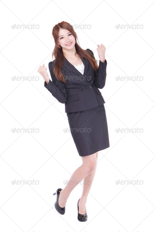 Business woman celebrating happy cheerful - Stock Photo - Images