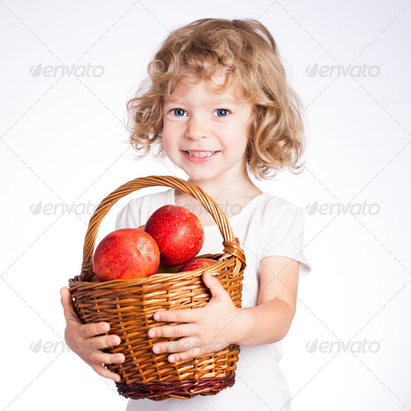 Child with basket of apples - Stock Photo - Images