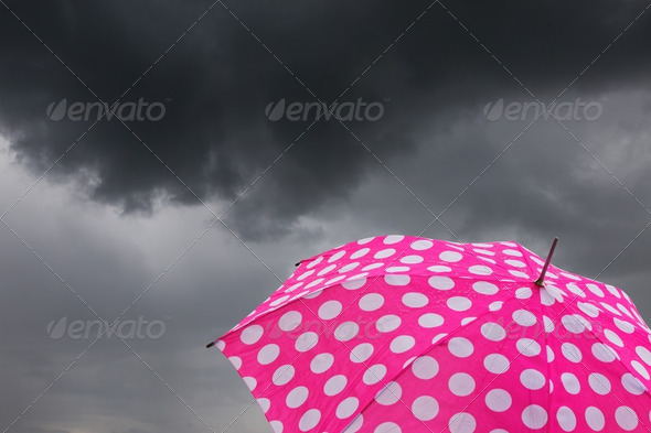 Umbrella with dark clouds