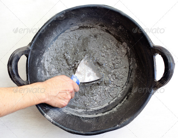 cement portland gray fresh mortar mix with spatula - Stock Photo - Images