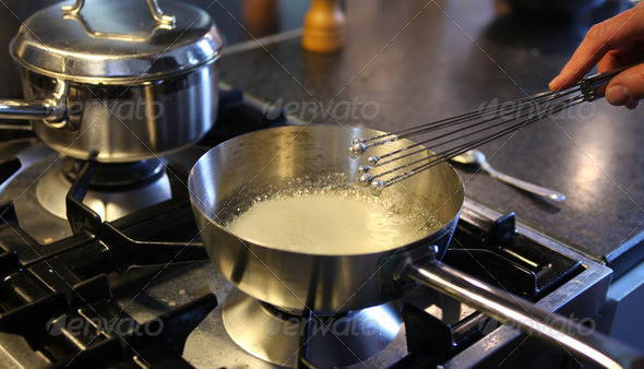 Melting and whisking sugar in pan