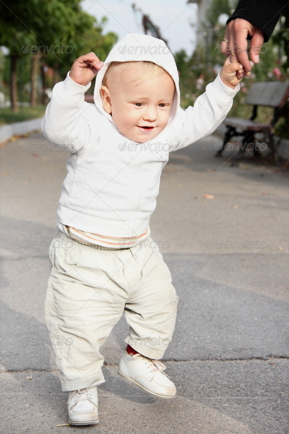 Little Cute Baby Boy First Steps Outdoors