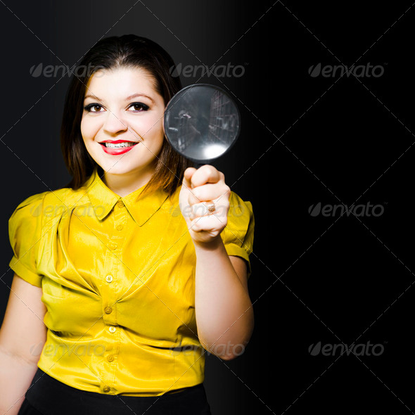 Woman with magnifier doing data recovery - Stock Photo - Images