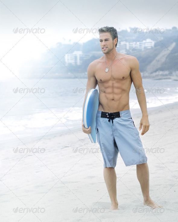 Serene surfer at the beach - Stock Photo - Images