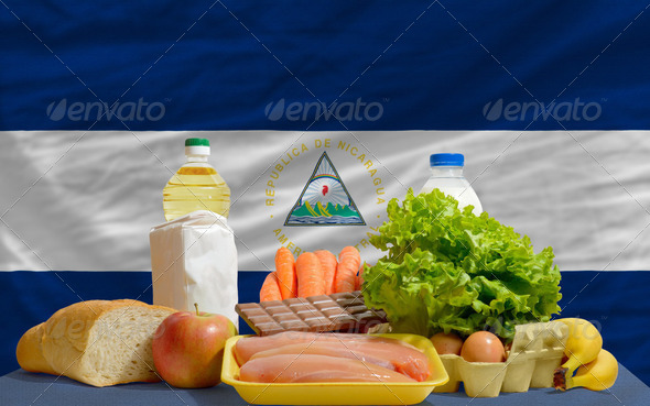 basic food groceries in front of nicaragua national flag - Stock Photo - Images