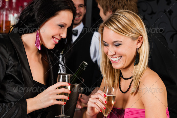Happy girl friends with drinks enjoying party - Stock Photo - Images