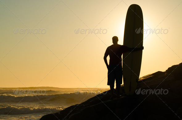 Long boarder watching the waves - Stock Photo - Images