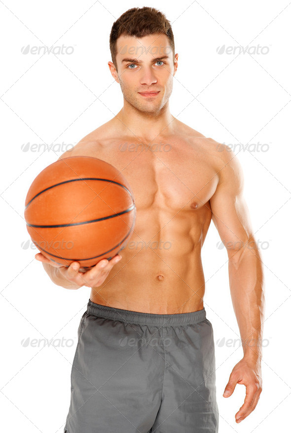 Handsome basketball player holding ball on white - Stock Photo - Images