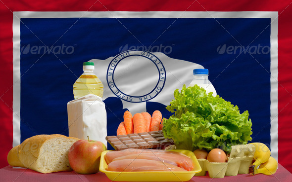 basic food groceries in front of wyoming us state flag - Stock Photo - Images
