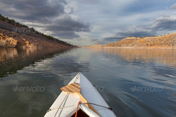 canoe on mountain lake - Stock Photo - Images