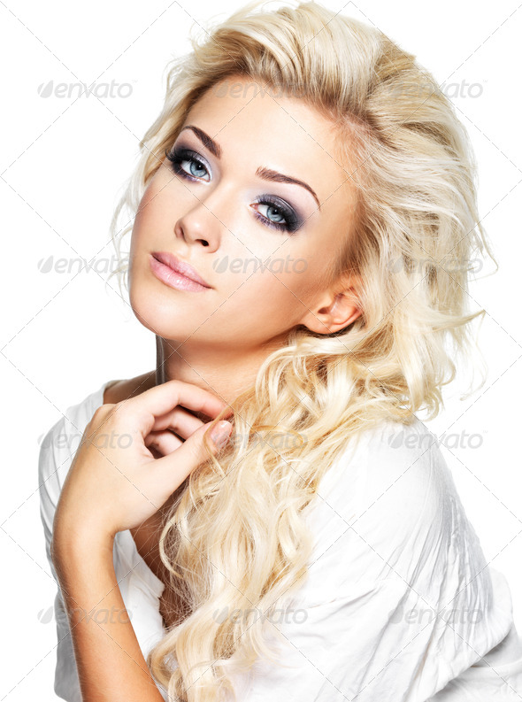 Beautiful blond woman with long curly hair and style makeup. - Stock Photo - Images