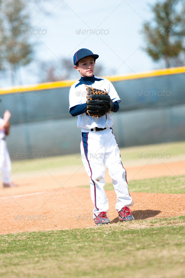 Little league pitcher waiting to pitch