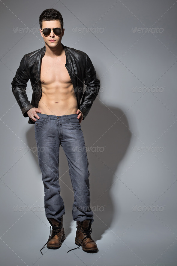Handsome young guy wearing black leather jacket - Stock Photo - Images