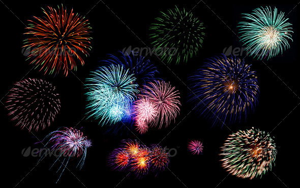 Colorful fireworks of various colors in night sky - Stock Photo - Images