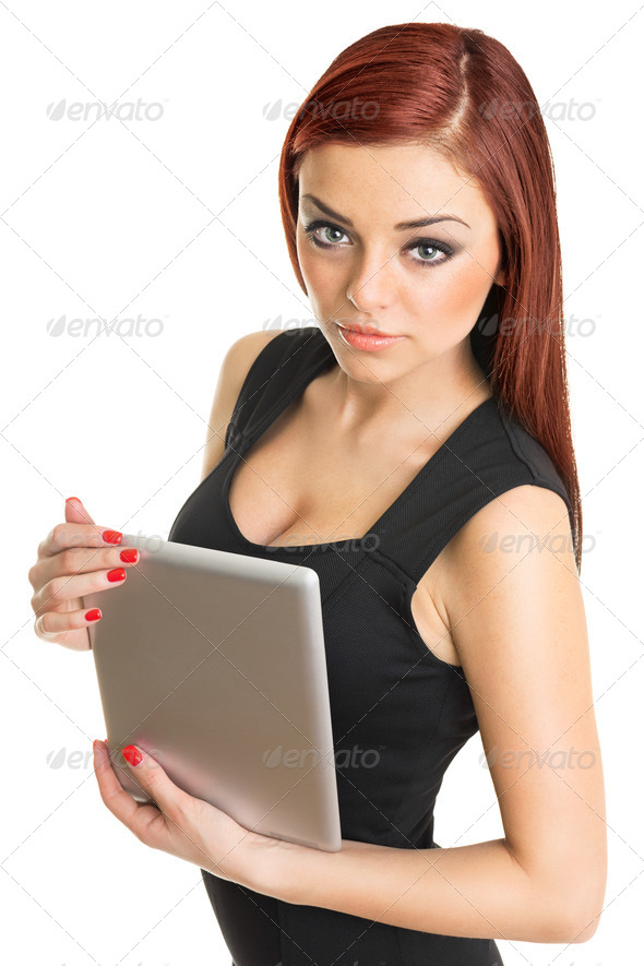 Attractive young redhead woman with freckles holding digital tablet - Stock Photo - Images