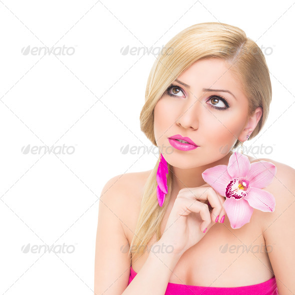 Gorgeous young blonde woman with pink orchid flower - Stock Photo - Images