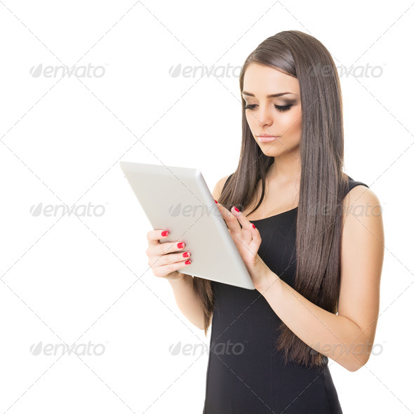 Elegant businesswoman using digital tablet - Stock Photo - Images