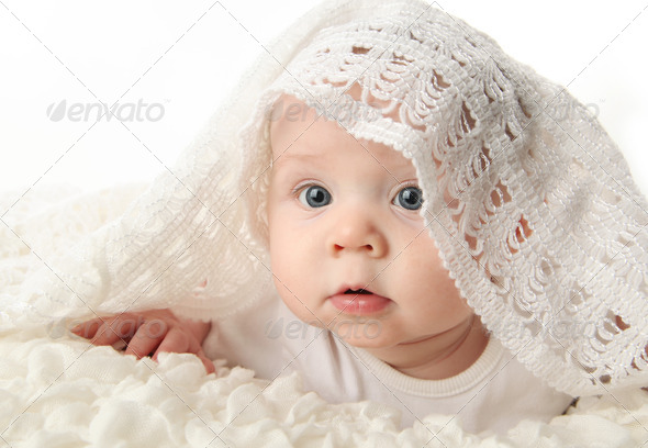 beautiful baby with blanket on head
