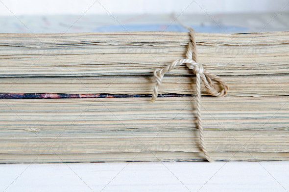 vintage magazines stack tied with old twine