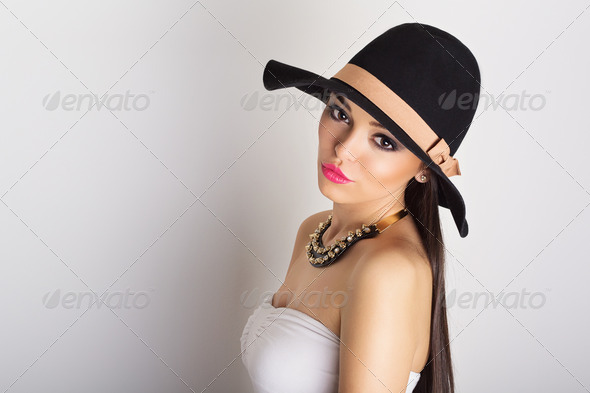 Attractive brunette wearing big black hat - Stock Photo - Images
