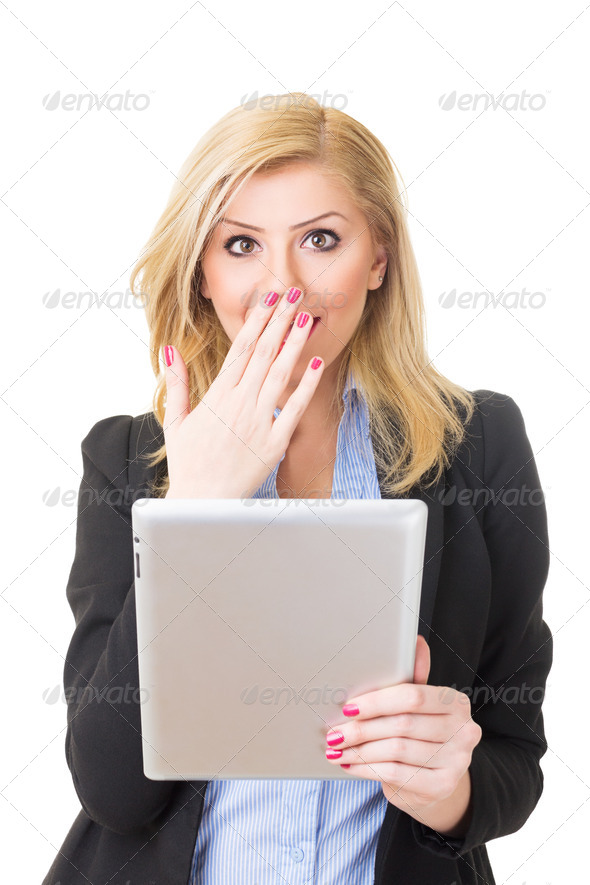 Surprised blonde businesswoman with tablet computer - Stock Photo - Images