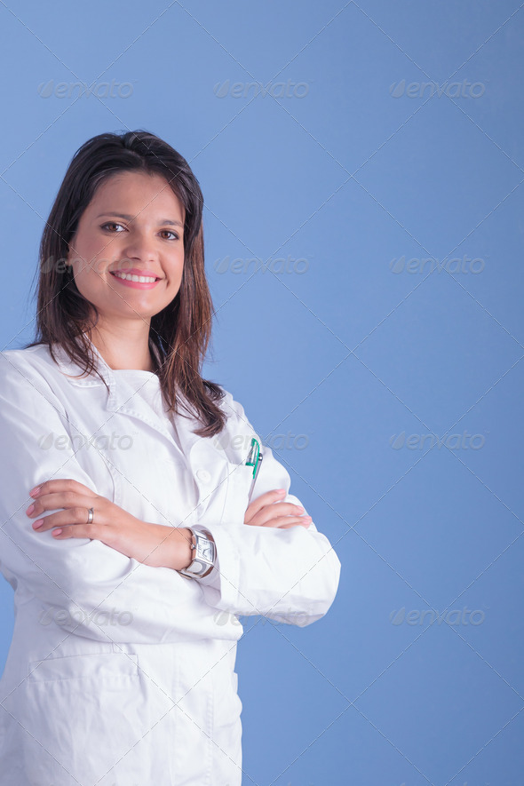 Young woman doctor with blue backgound