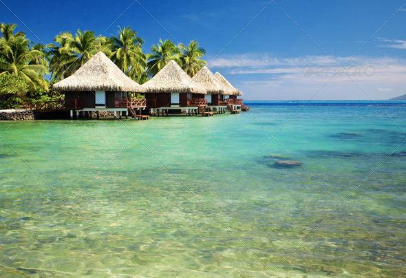 Over water bungalows with steps into amazing lagoon - Stock Photo - Images
