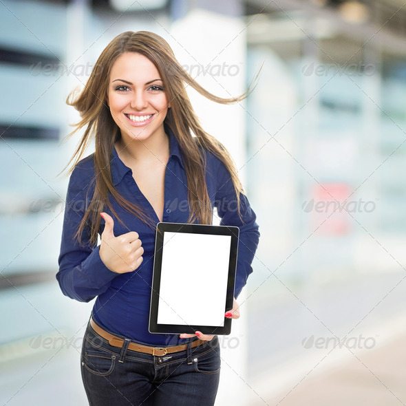 Positive young businesswoman with tablet computer - Stock Photo - Images